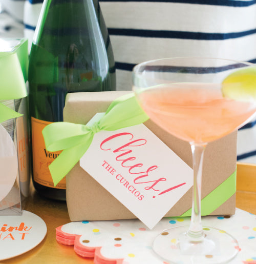 Cheers gift tags shown here in a peachy coral color. Perfect for gifts.