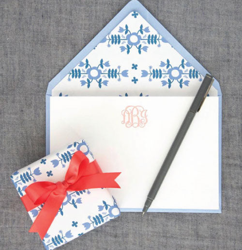 Beautiful letterpress stationery shown here with a pink monogram and beautiful lined blue envelopes.