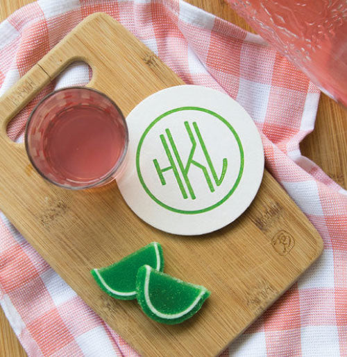 Personalized coasters shown here with a 3-letter monogram with apple green ink. Cute!