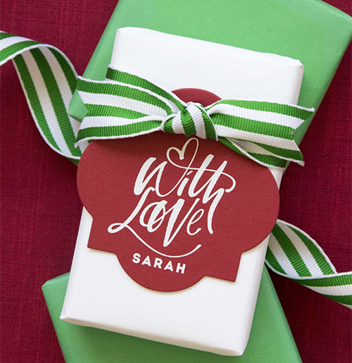 With love Christmas tags shown here with white ink on red paper.